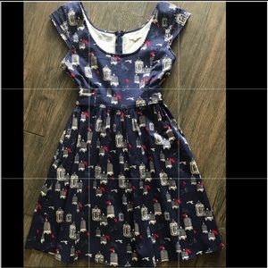 Navy dress with red bird & cage print